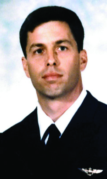 A formal portrait of Captain Michael Scott Speicher in his naval aviator uniform.
